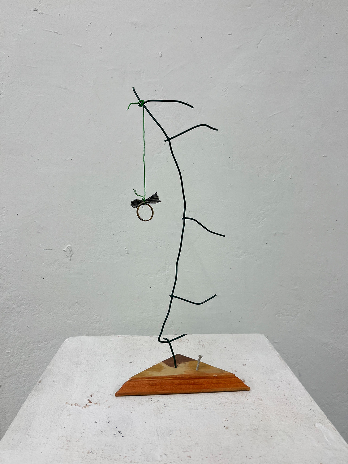A hemp, fabric, metal, thread, wood sculpture that resembles the work of Joan Miró